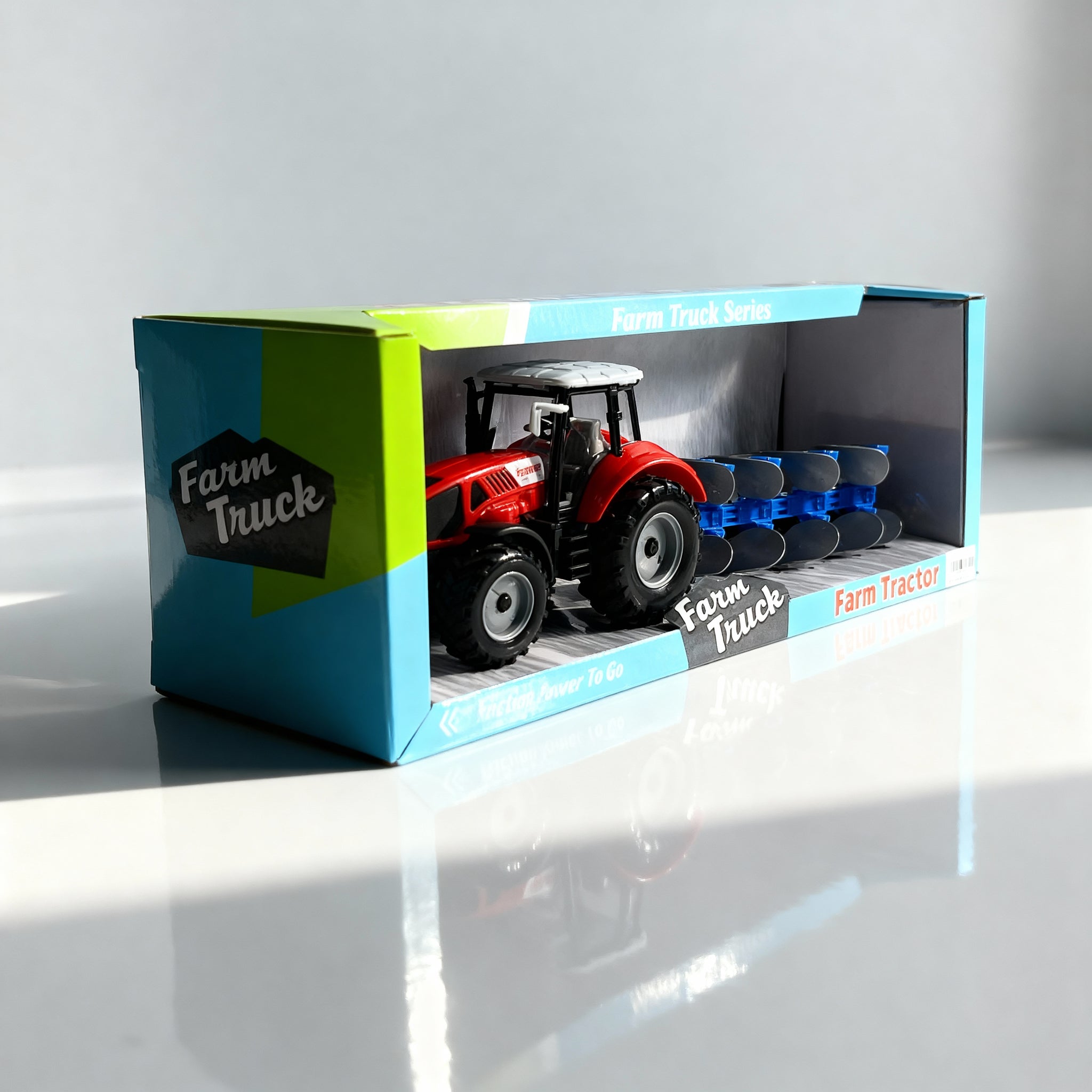 Traktor sa plugovima igračka